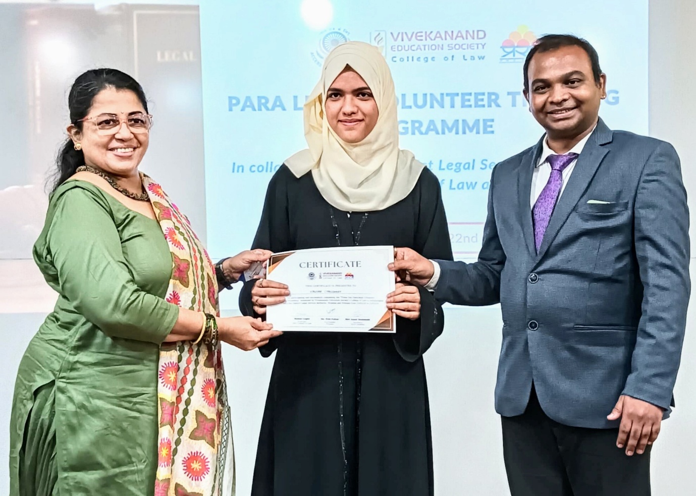 Presentation of PLV Certificate to law student volunteer with Dr. Choudhary