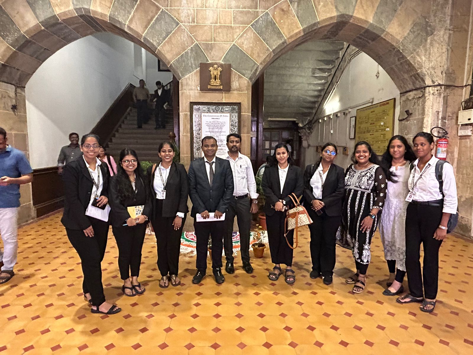 Mentors and Students in Court Foyer