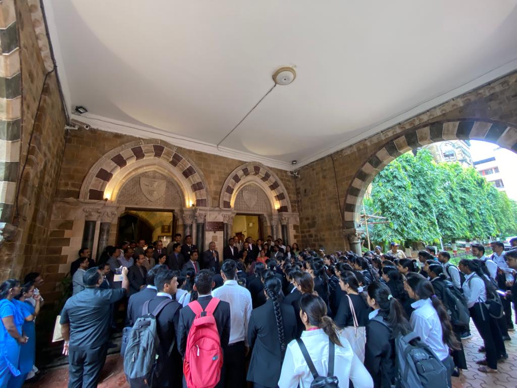 Dr. Swapnil S. Choudhary briefing law students outside High Court portico