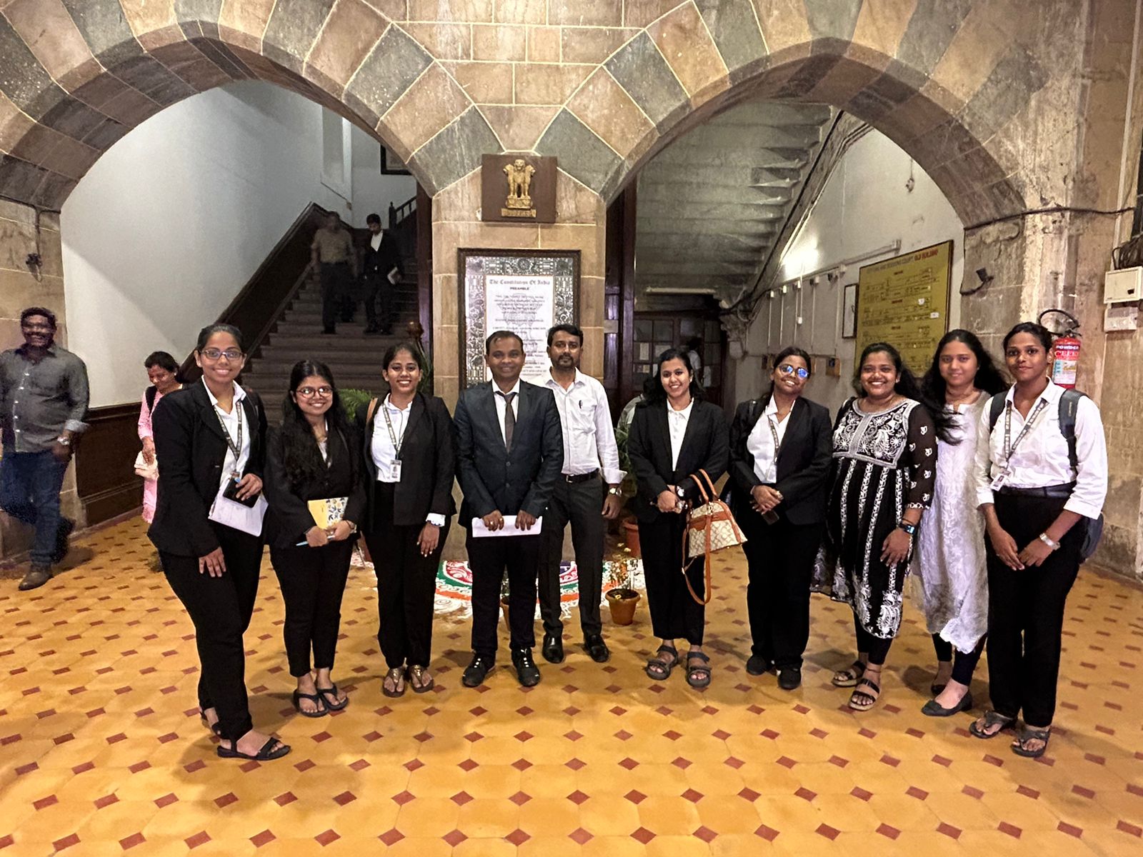 Judicial Delegation in Historic Hallway beneath portraits